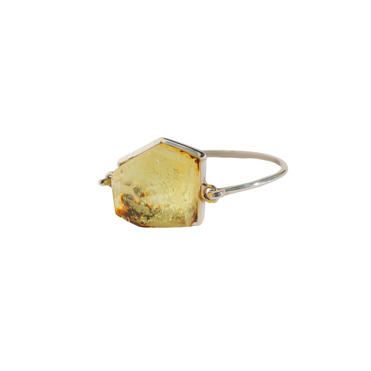 Green amber bracelet with sterling silver band and modern cut design.