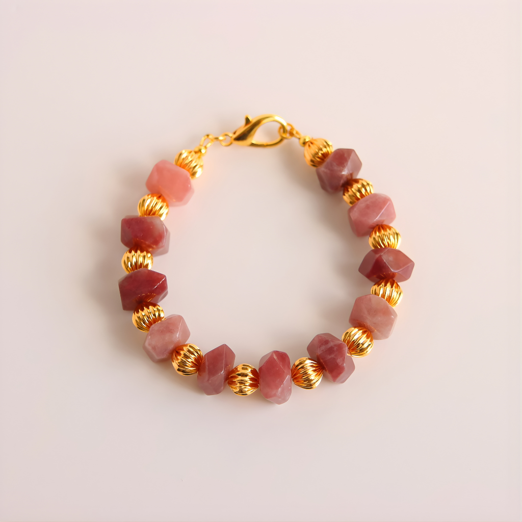 pink Botswana agate Bracelet beads and gold accents on a light pink background