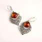 Sterling Silver earrings with amber stones on a white background