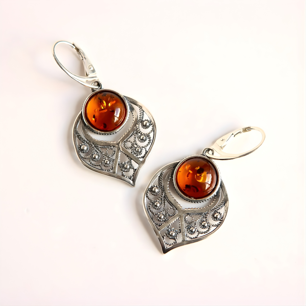 Sterling Silver earrings with amber stones on a white background