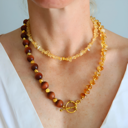 Handmade layered necklace with goldstone and citrine, gold plated beads, gold flower accents, choker and long strand design by Alexis Cintron.