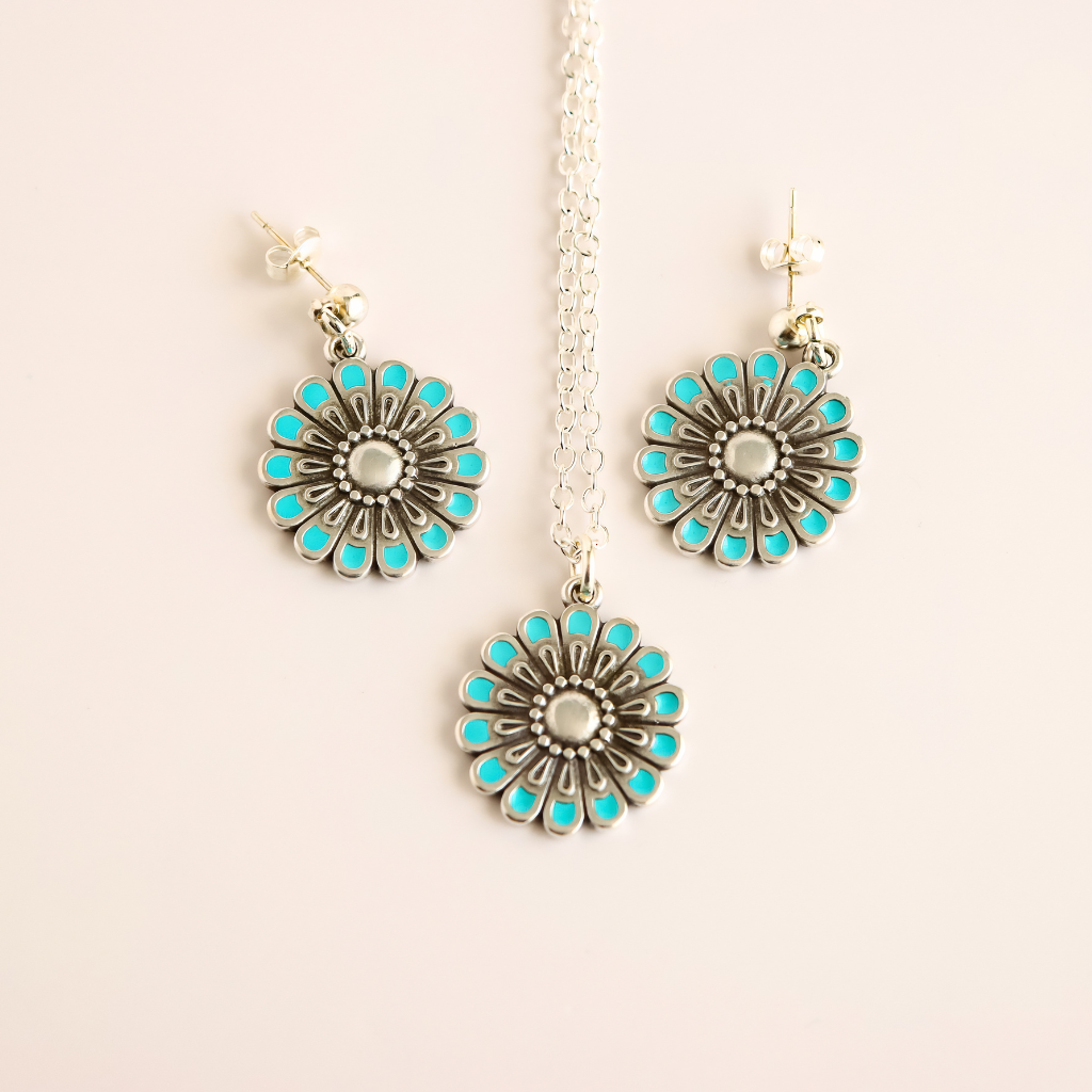 Flower Jewelry set with blue accents and silver on pink background