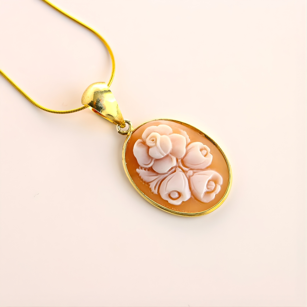 Gold flower necklace on a light pink background