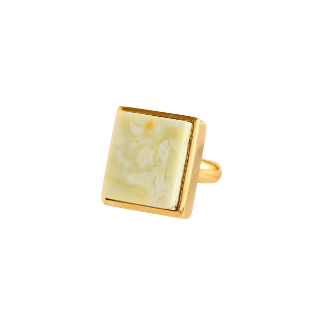 Butterscotch amber ring in 14k gold with marbled white stone.
