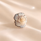 flower ring with a beige background