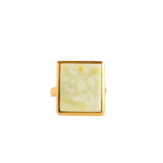 Butterscotch amber ring in 14k gold, elegant statement piece with marbled white stone.