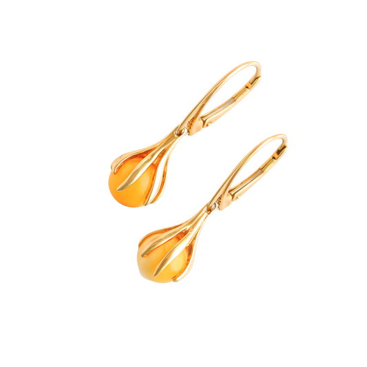 Gold Amber Earrings Baltic amber claw dangle earrings in 14k gold-plated S925, showcasing Butterscotch Amber.