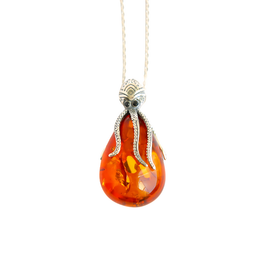 Genuine cognac amber octopus necklace in 925 sterling silver with sparkling black eyes and lifelike suction cup detailing, sea life jewelry, 18-inch chain.