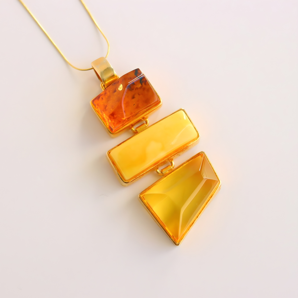 Amber pendant statement necklace on a light background