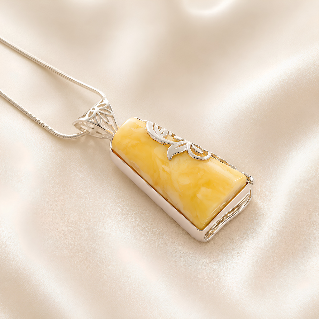 butterscotch amber Necklace with a rectangular amber pendant on a beige background
