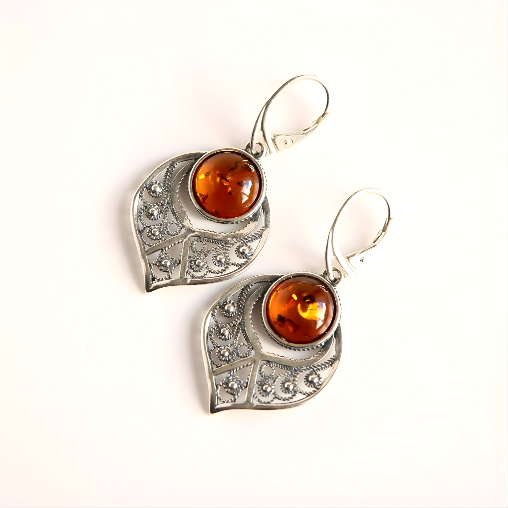Sterling Silver earrings with amber stones on a white background