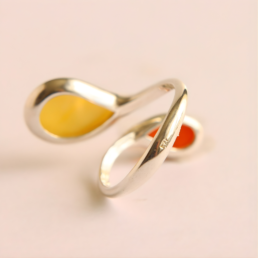 Sterling Silver ring with a yellow stone on a light beige background