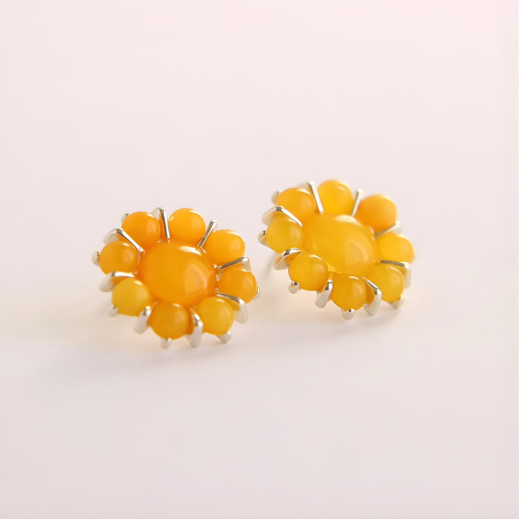 Yellow flower earrings on a light beige background