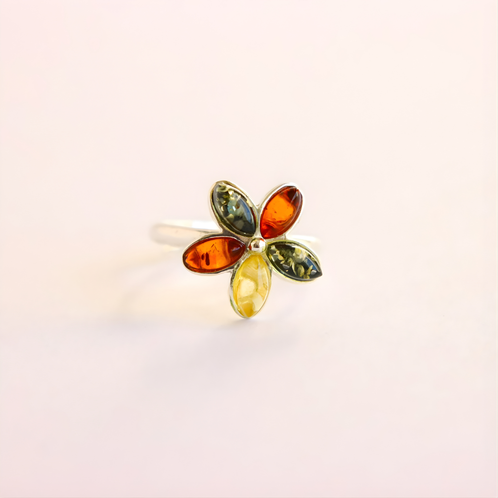 amber Ring with multicolored gemstones on a light background
