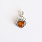 A amber spider-shaped silver pendant featuring a polished amber-colored gemstone in the center, set against a plain white background.
