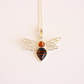 silver amber bee pendant with amber-colored heart and orange gemstone on a white background. amber bee necklace