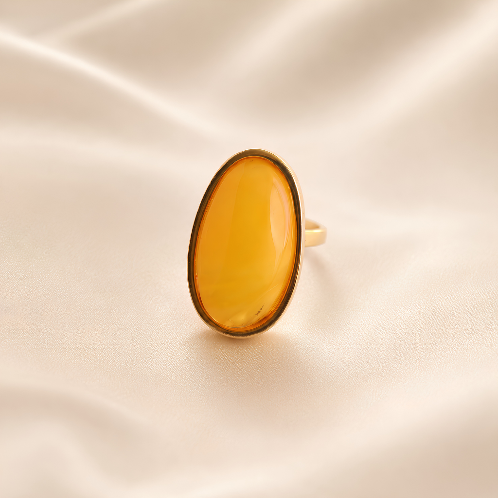 amber Ring with a yellow gemstone on a beige fabric background