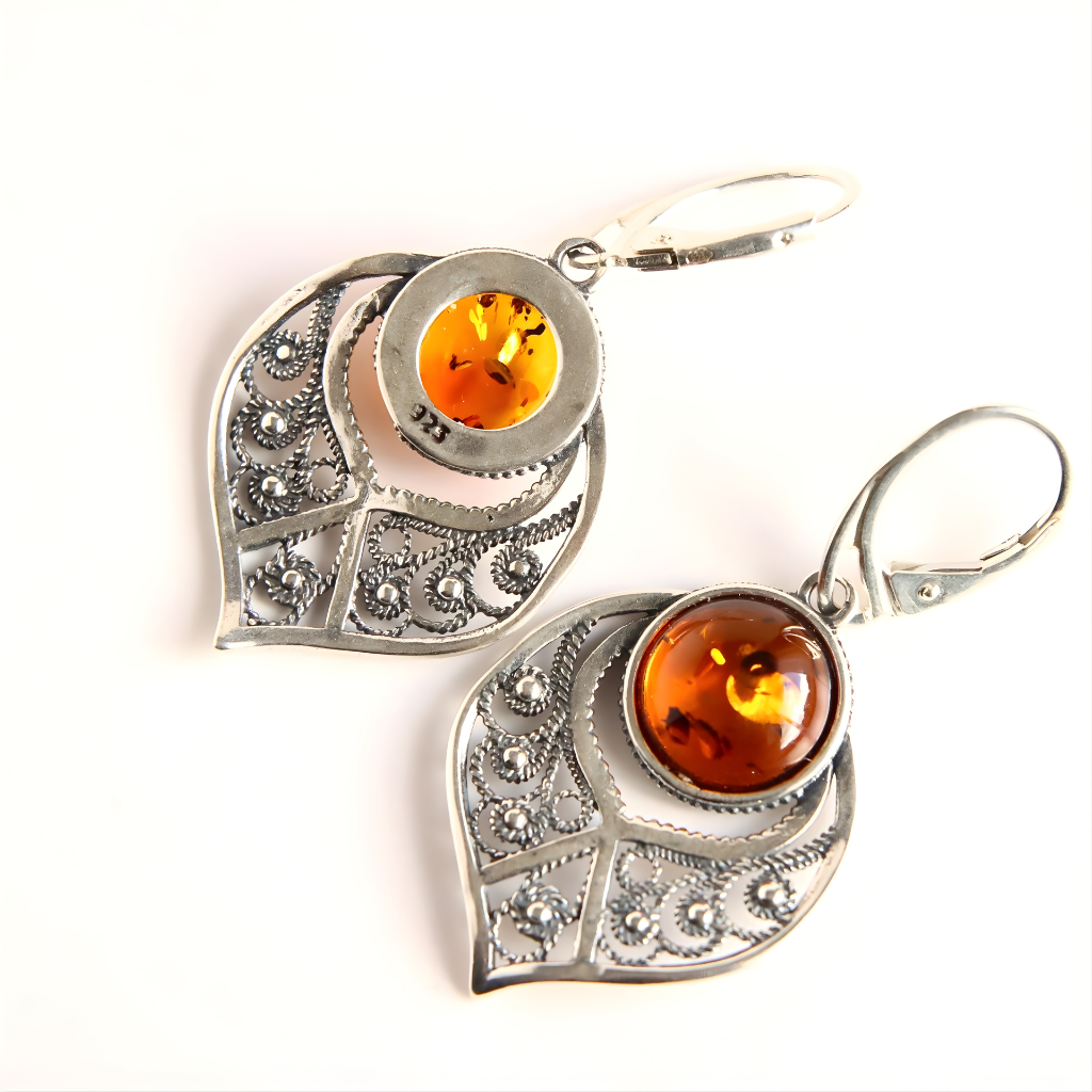 sterling Silver earrings with amber stones on a white background