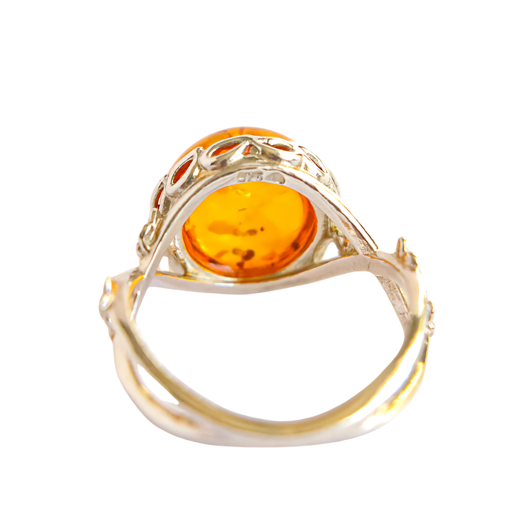 Baltic Cognac Amber ring in sterling silver with delicate silver flower accents.