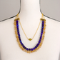 Lapis, citrine, and olive jade statement necklace displayed on a mannequin to show length and fit.