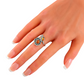Natural Baltic Cognac Amber adjustable flower ring on a hand, featuring a vintage-inspired 925 sterling silver band.