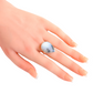 Genuine Dendritic Opal Ring in pear cut set in 925 sterling silver on a hand.