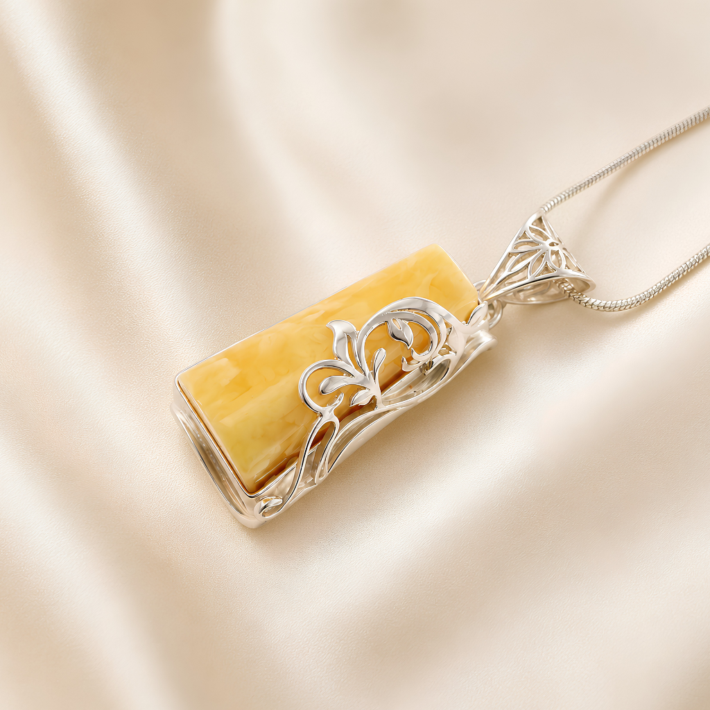 butterscotch amber Necklace with a yellow stone pendant on a beige background