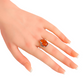Baltic amber ring with Victorian design in sterling silver on hand.