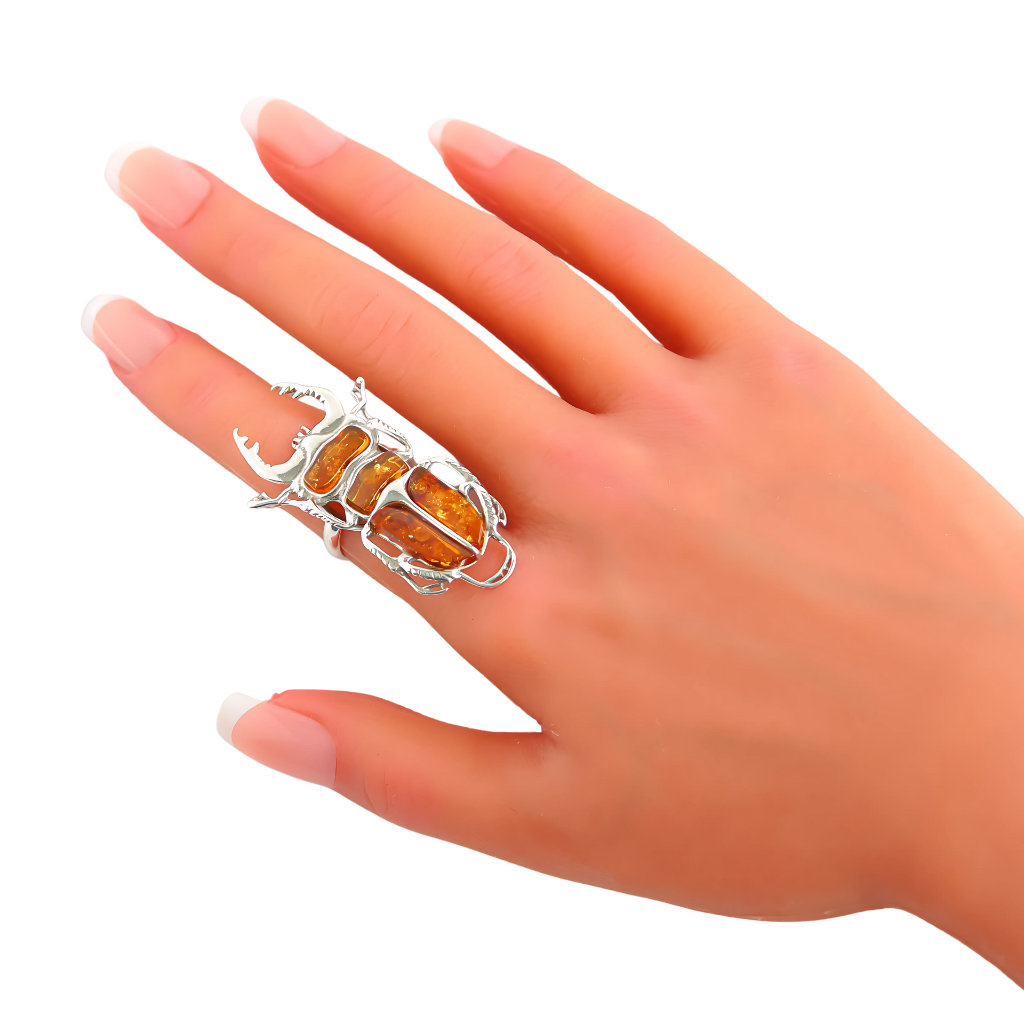 Baltic Amber Scarab Ring in 925 Sterling Silver on finger.