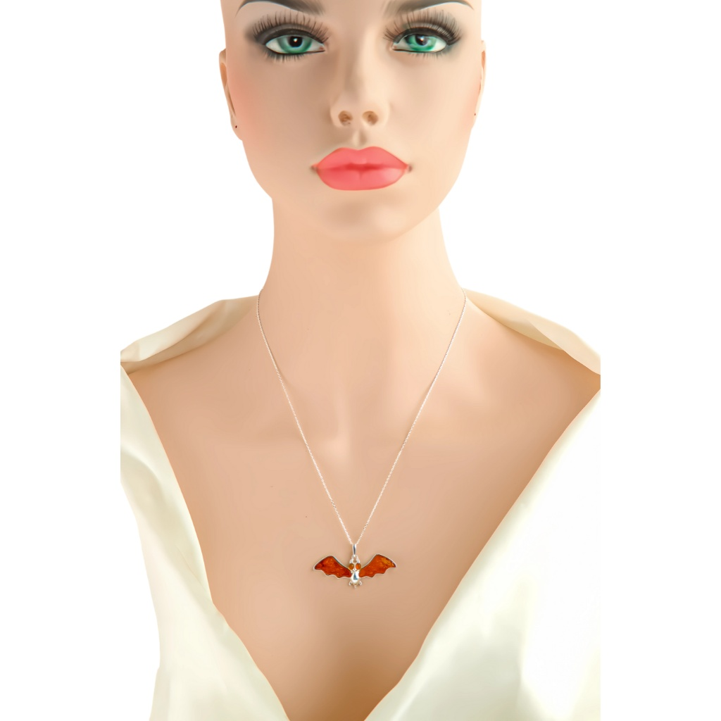 Baltic Amber Pendant Necklace in 925 Sterling Silver worn by mannequin, featuring cognac amber bat motif.