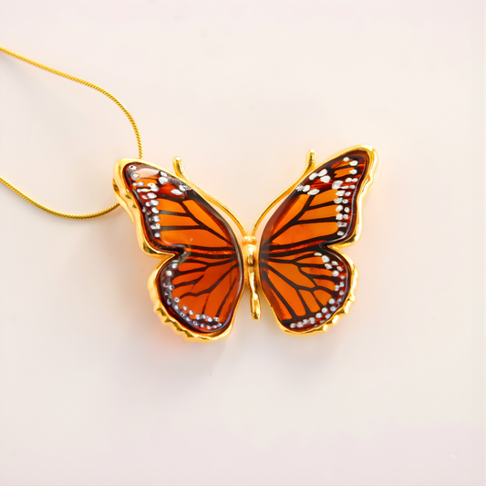 Butterfly Necklace with gold frame on a light background