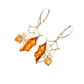 Baltic amber spiderweb dangle earrings in 925 sterling silver with intricate laser-cut design.