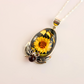 amber Necklace with a sunflower pendant on a light background