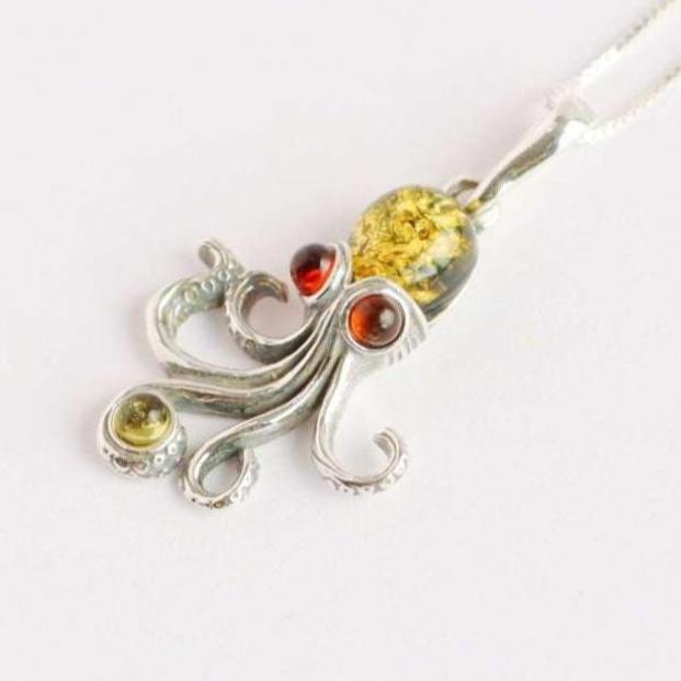 Baltic amber octopus pendant necklace with green and red amber on 925 sterling silver chain.