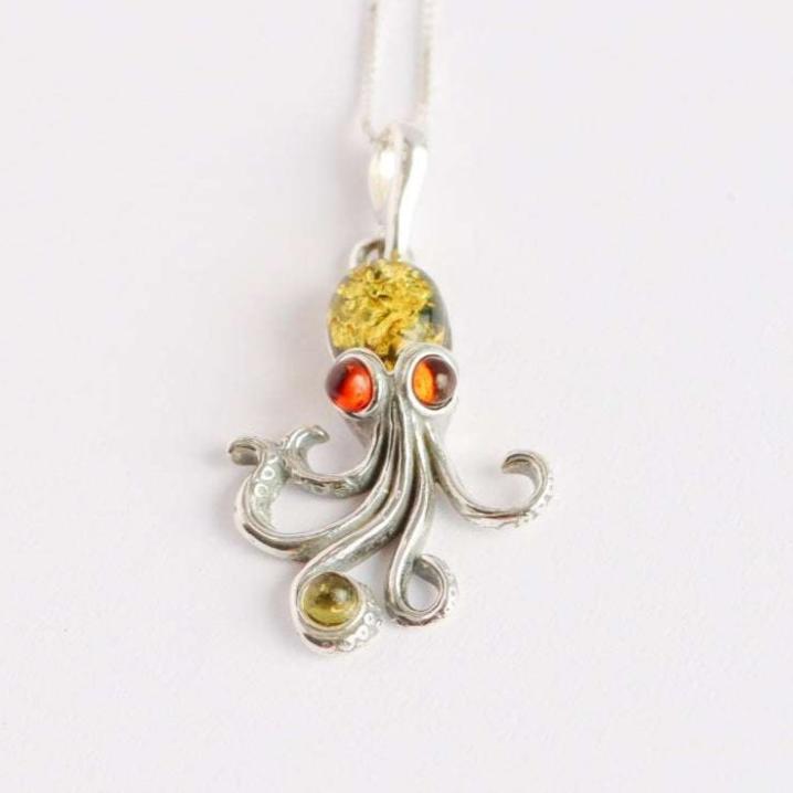 Baltic amber octopus pendant necklace in 925 sterling silver with green and red amber.
