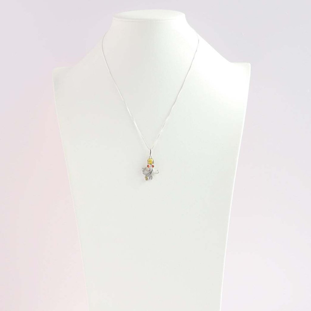 Baltic Amber Octopus Pendant Necklace in Sterling Silver with Green and Red Amber on Display Bust.