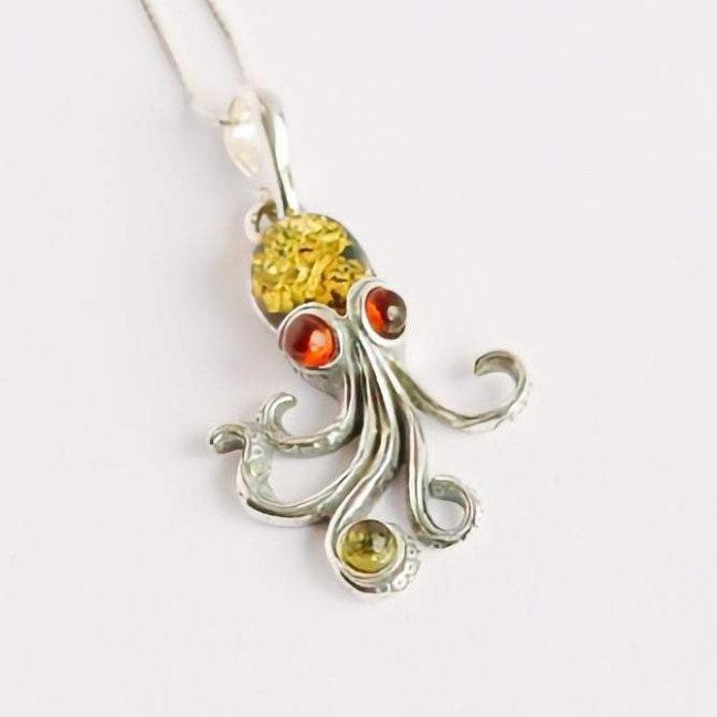 Baltic amber octopus pendant necklace with green and red amber in 925 sterling silver.