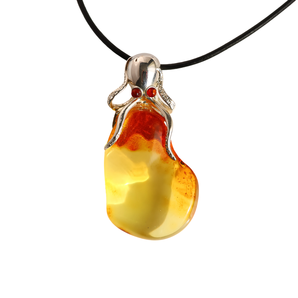 Baltic amber octopus pendant necklace in 925 sterling silver with cognac to lemon ombre on leather cord.