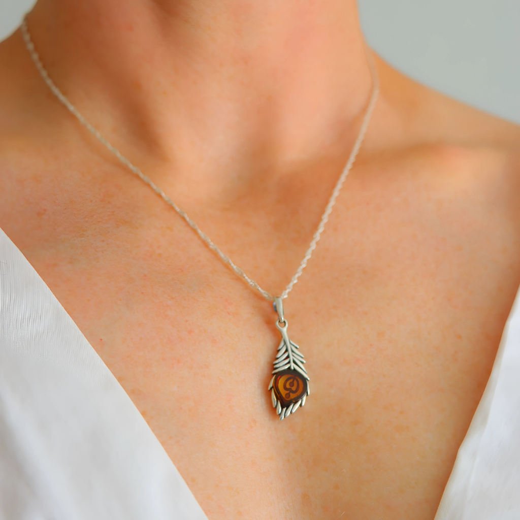 Silver feather amber necklace three quarter view on neckline