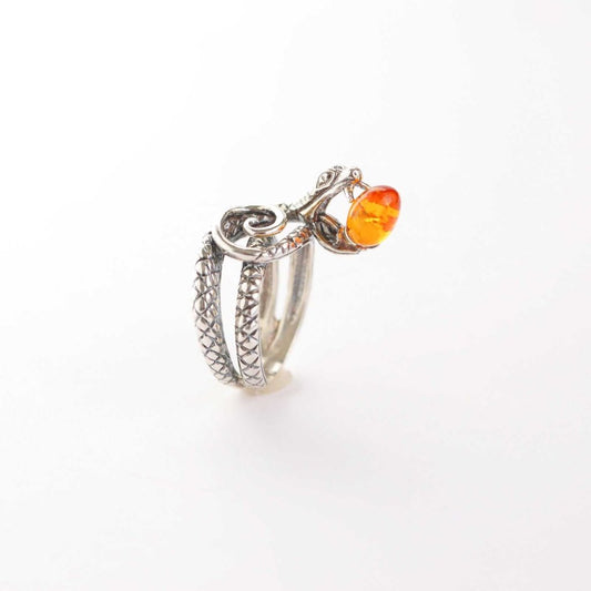 Baltic cognac amber cobra ring in 925 sterling silver with intricate design.