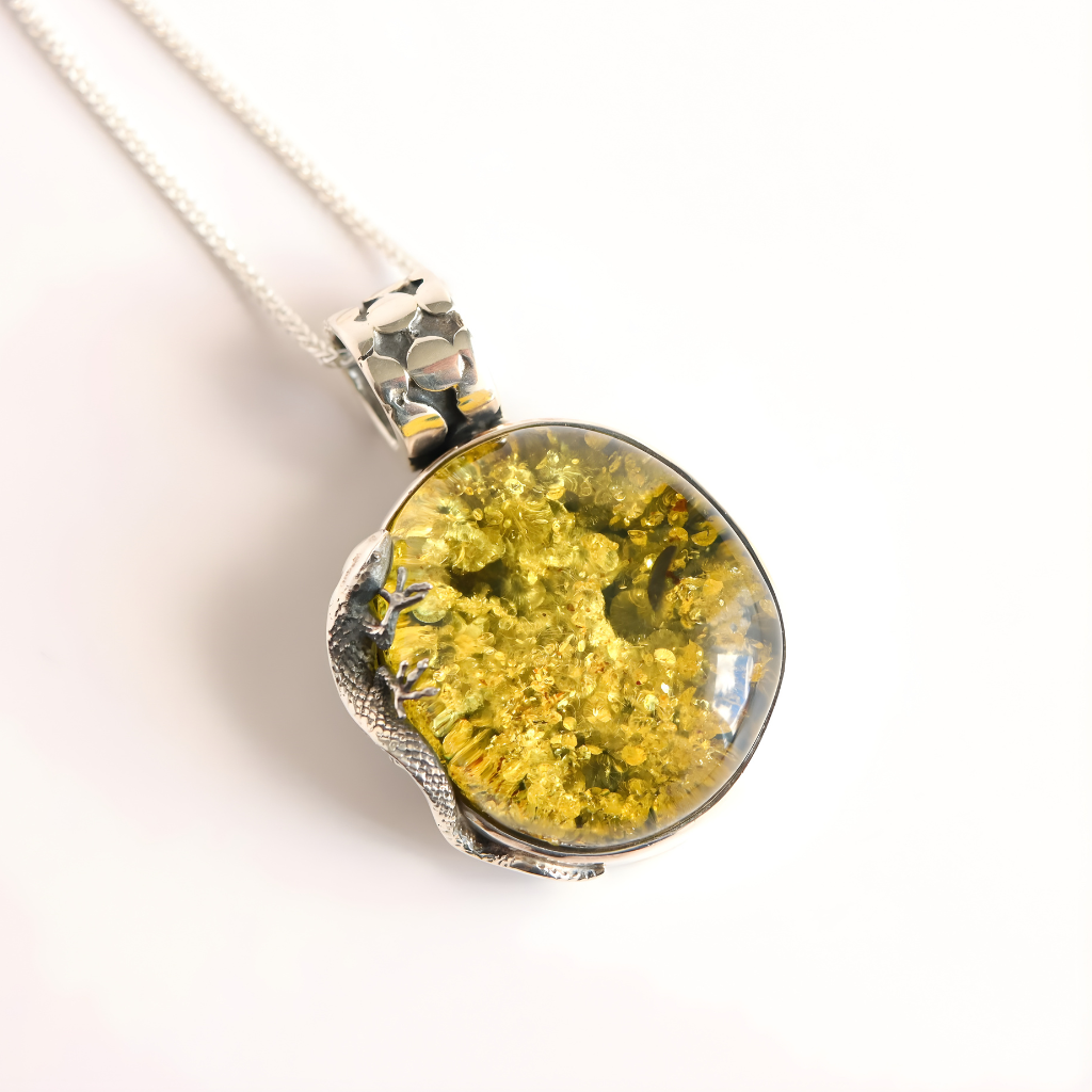 Necklace with a round green amber pendant featuring a yellowish-green natural design on a white background