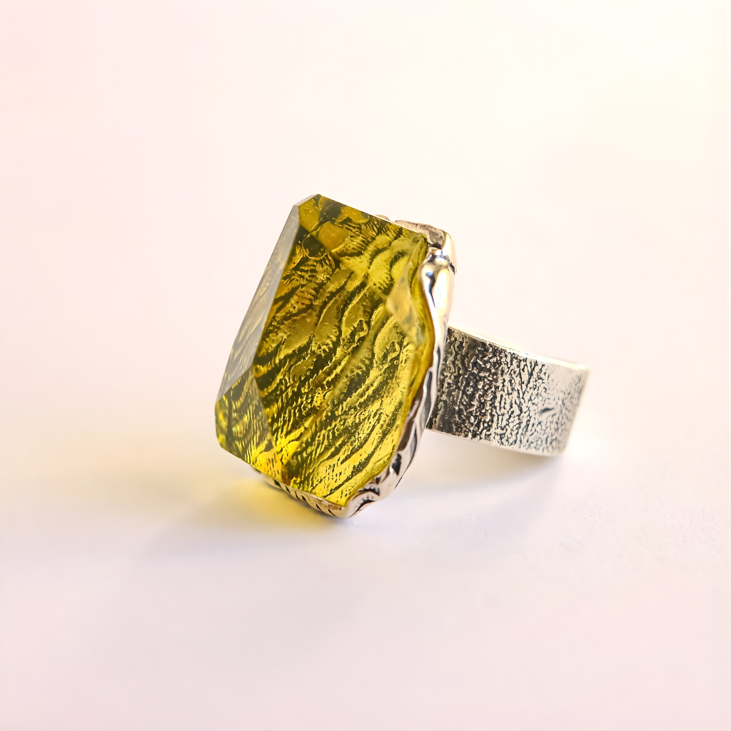 silver amber ring on a white background