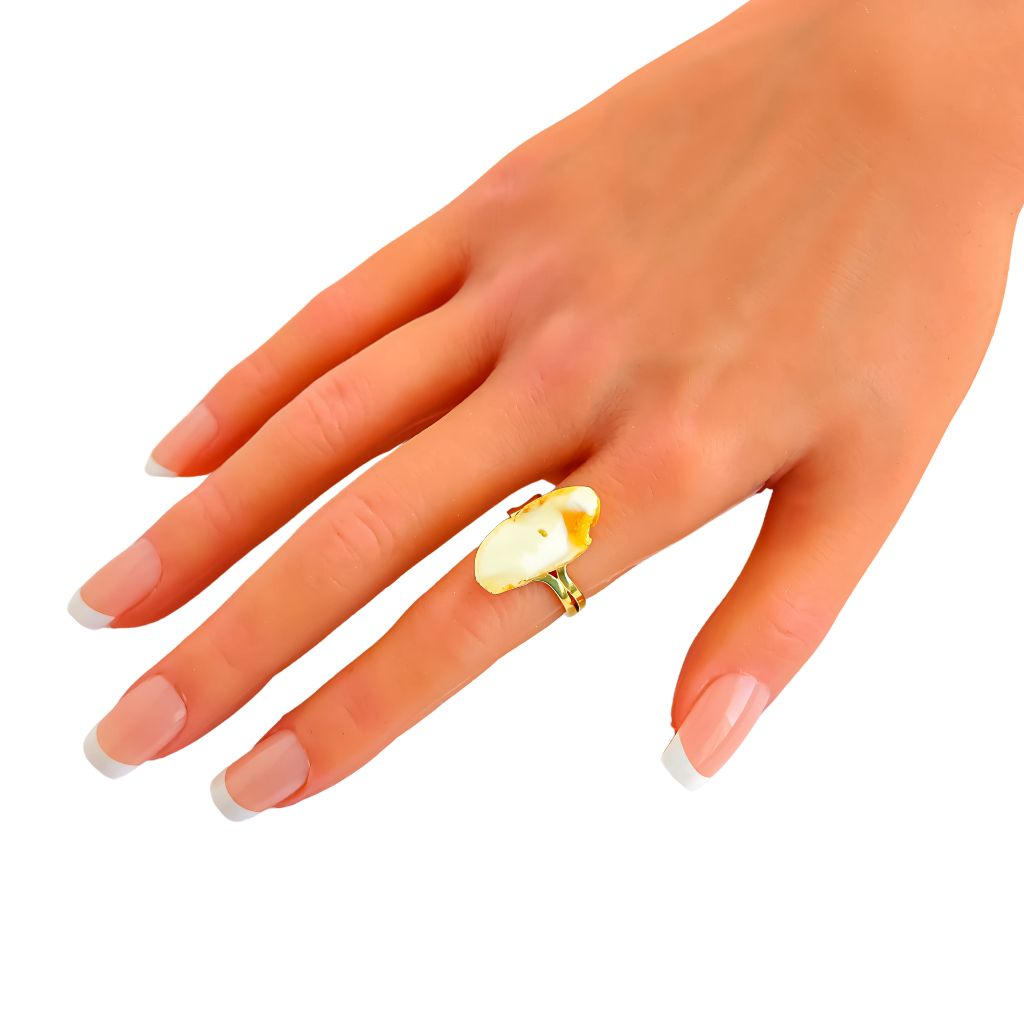 Baltic white and honey sugared amber ring in 925 sterling silver with 14k gold plating on hand.
