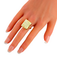 Butterscotch amber ring in 14k gold on hand, elegant statement piece.