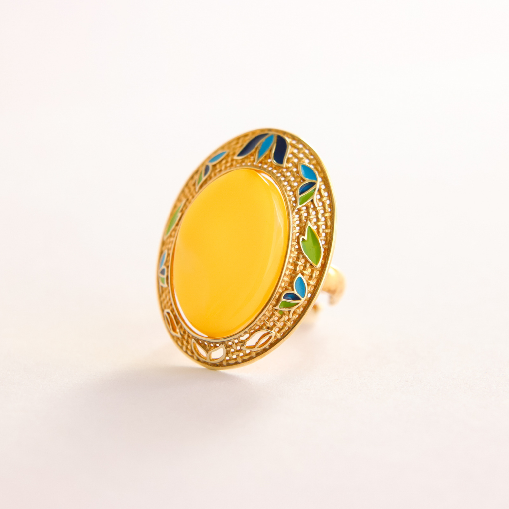 Gold butterscotch amber ring with a yellow center and green and blue accents on a white background
