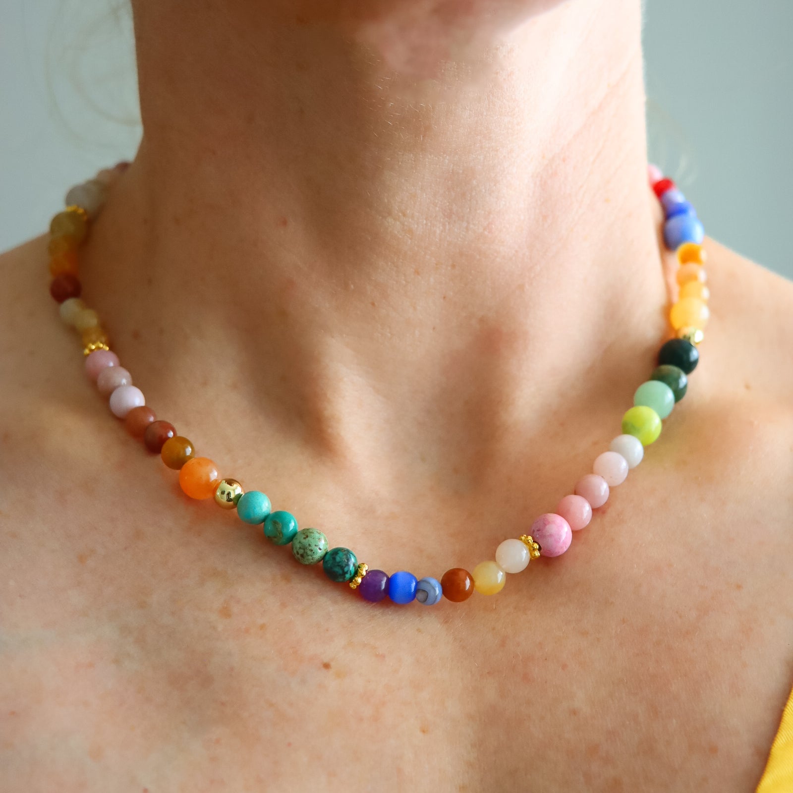 Colorful beaded Opal and Turquoise necklace with 18k gold-filled beads worn on collarbone