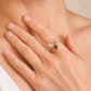 amber bee ring with orange and black gemstone with silver wings on models hand on neutral background