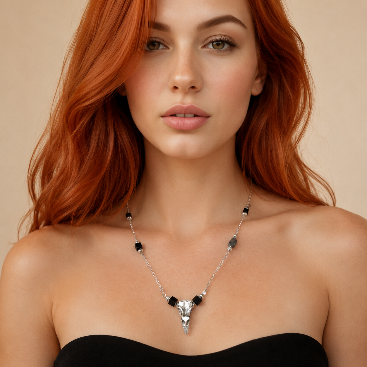 Woman wearing a raven skull necklace against a beige background