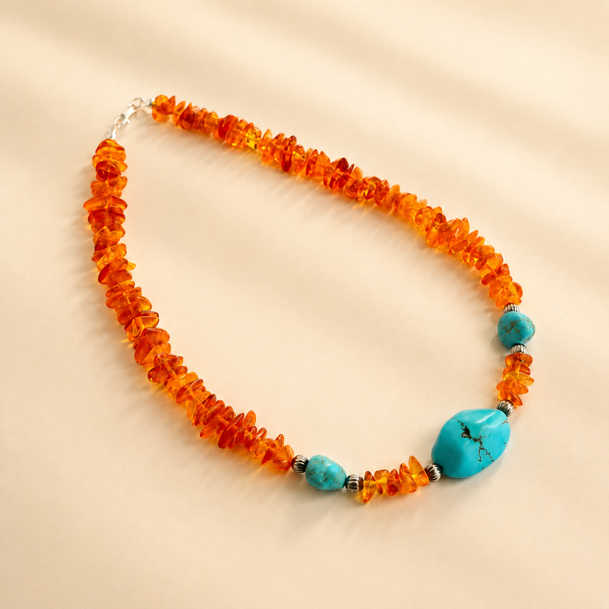 beaded Necklace with orange beads and turquoise accents on a beige background