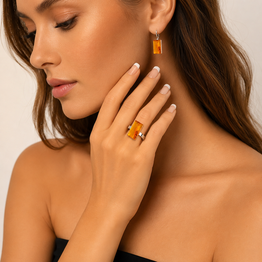 rectangular amber ring on model on neutral background.